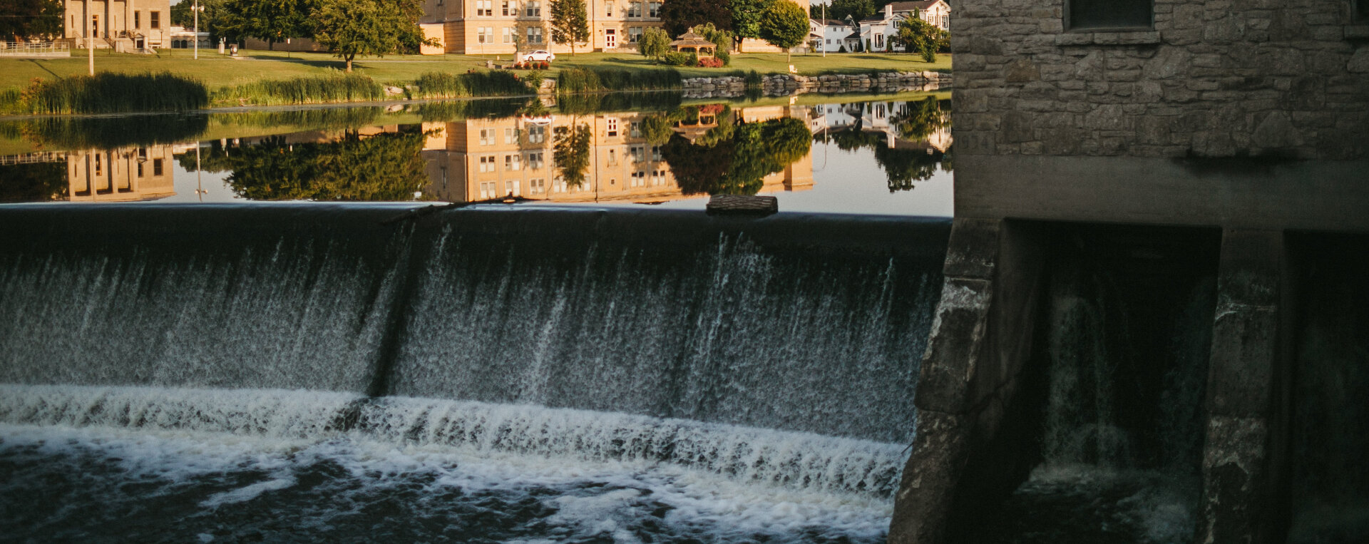 Water flowing over dam in creek