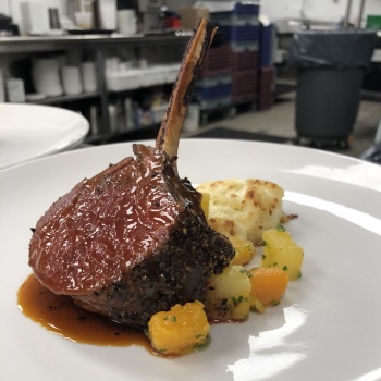 Coffee - rubbed venison rack with potato gratin and root vegetables