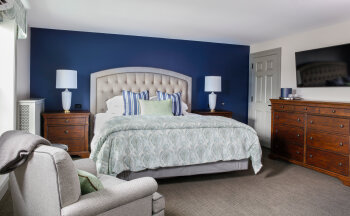 Bed in Ganson Suite at Farmer's Creekside Tavern & Inn